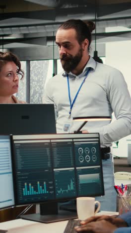 vertical video team of staff members work with high tech and performance metrics