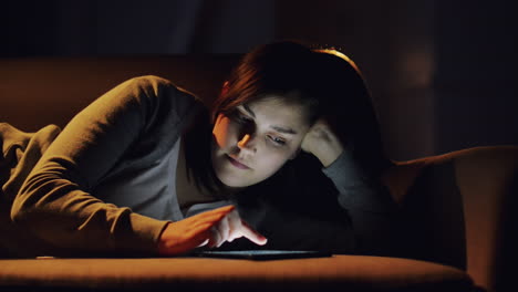 woman using tablet computer online shopping at home