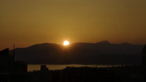 time-lapse of a sunset over the mountains in beautiful vancouver, british columbia, canada on a clear evening