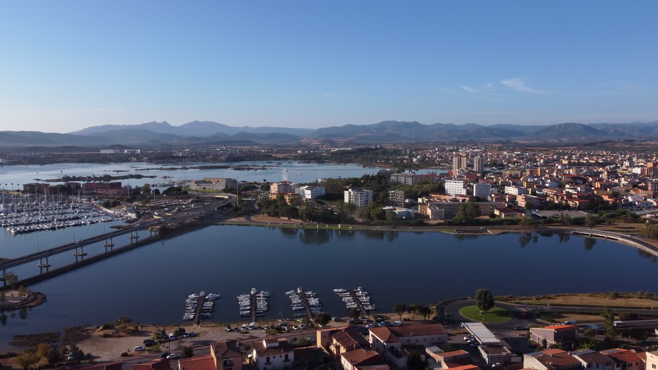 Panoramic view of Olbia on sunny day, Sardinia, Italy. Aerial rising