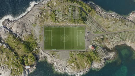 descending aerial footage of famous football stadium in henningsvær