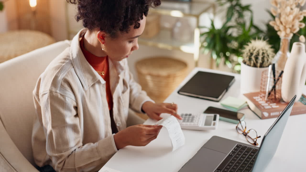 Woman Paying Bills at Home