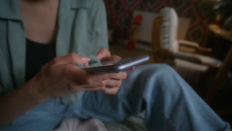 woman using smartphone at home