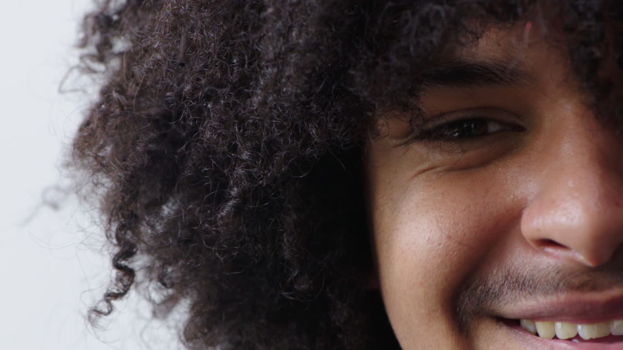 Closeup of a black man with curly afro hair