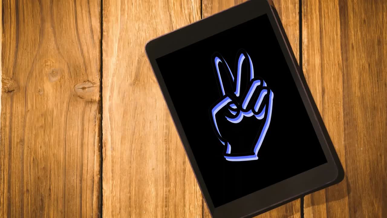 animación del icono de la mano parpadeando y cambiando de color en la pantalla de una tableta digital colocada en una tableta de madera