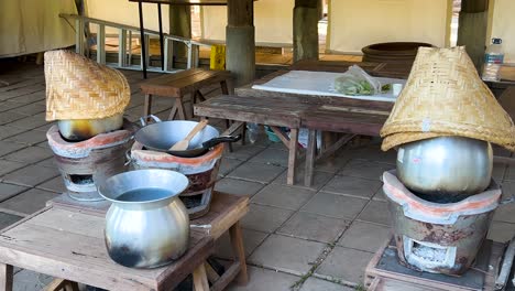 charcoal stoves with pots and woven baskets