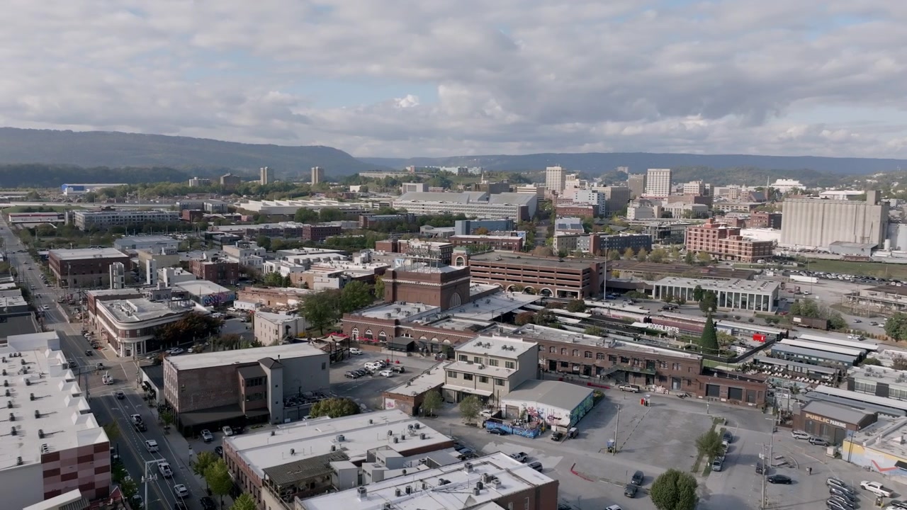 Wide aerial footage in Chattanooga, TN slowly rotating around the Chattanooga Choo Choo hotel with downtown in the back.