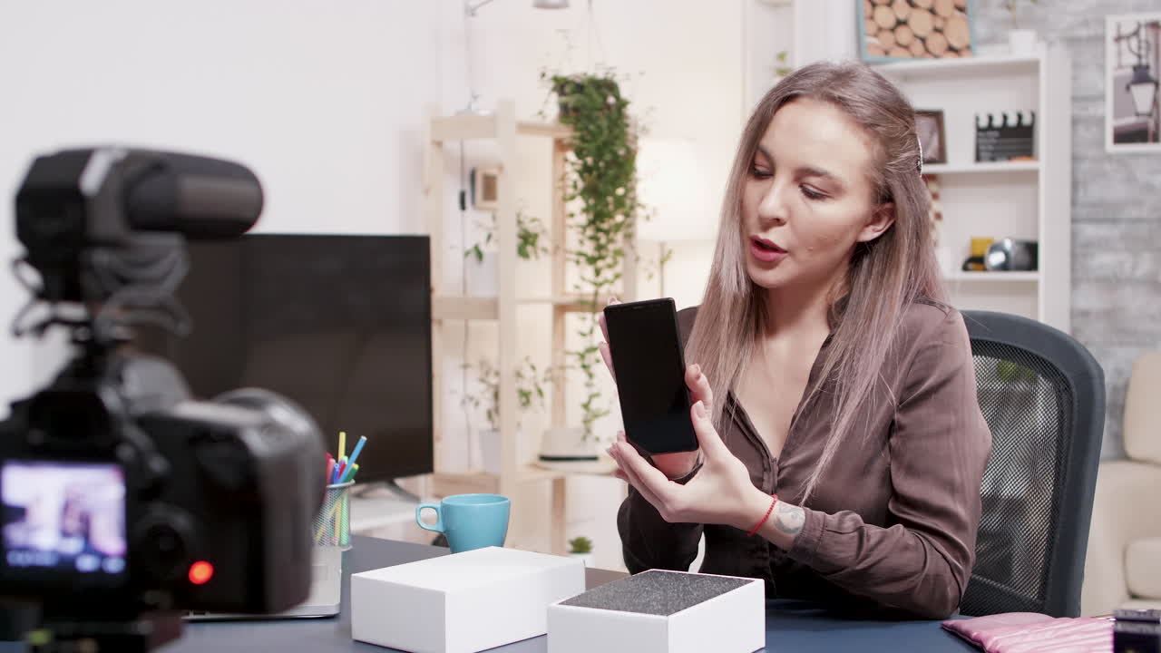 Woman vlogging about a new smartphone
