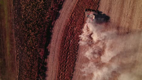 Bird-eye-aerial-view-captures-farm-tractor-as-it-gracefully-moves-through-vast-fields-of-non-GMO-soybeans