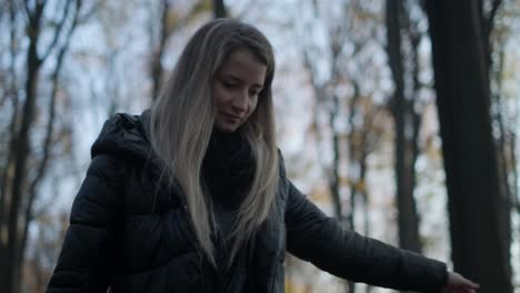 Woman-Walking-in-Forest---A-close-up-of-woman-while-trying-to-keep-balance-on-a-log