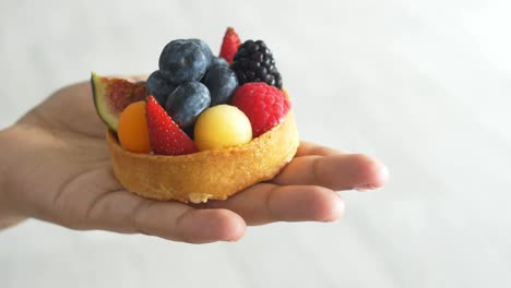 women eating berry fruit tart