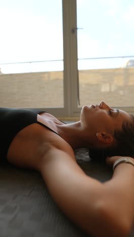 woman relaxing in yoga pose