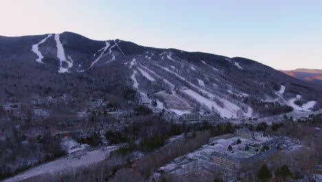 Aerial-cinematic-drone-pan-reveal-backwards-sunrise-of-ski-trails-at-Loon-Mountain-Resort-New-Hampshire