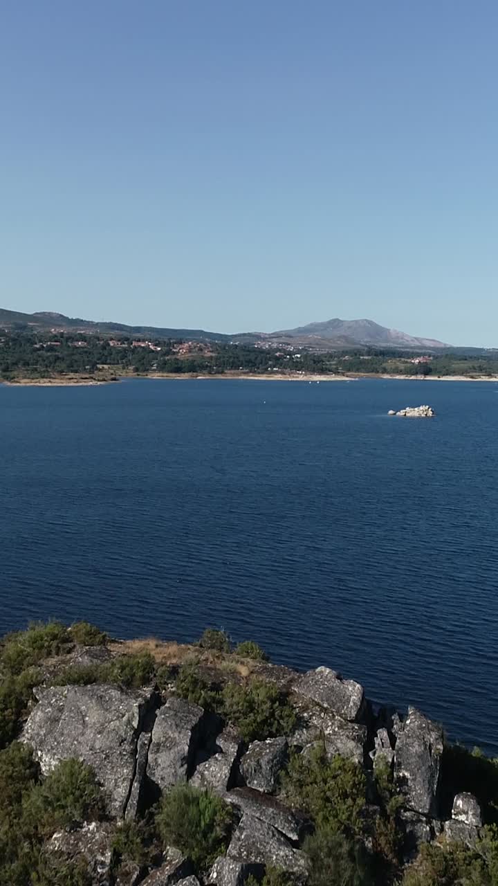 Beautiful Nature Landscape. Blue Lake and Green Mountains Vertical Video