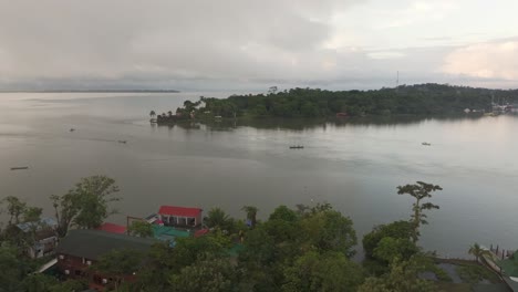 Drone-view-of-Rio-dulce-river-with-Castillo-de-San-Felipe,-aerial