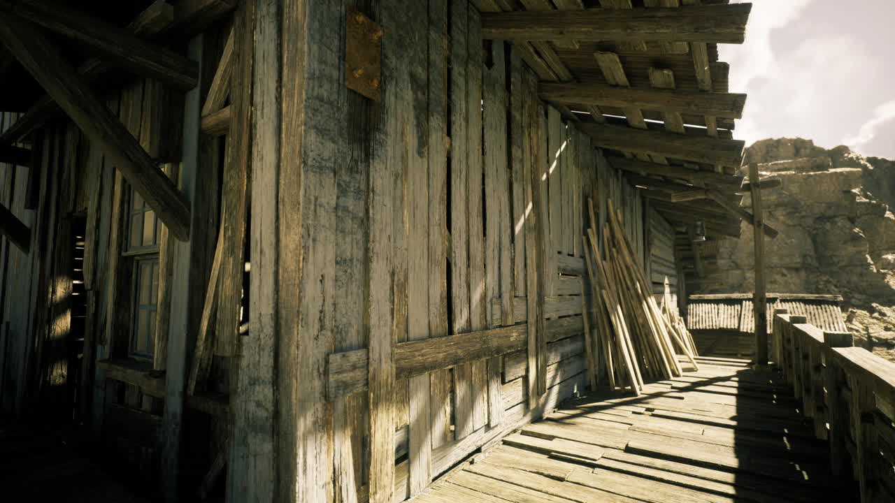 Weathered wooden building located in a remote area under bright sunlight