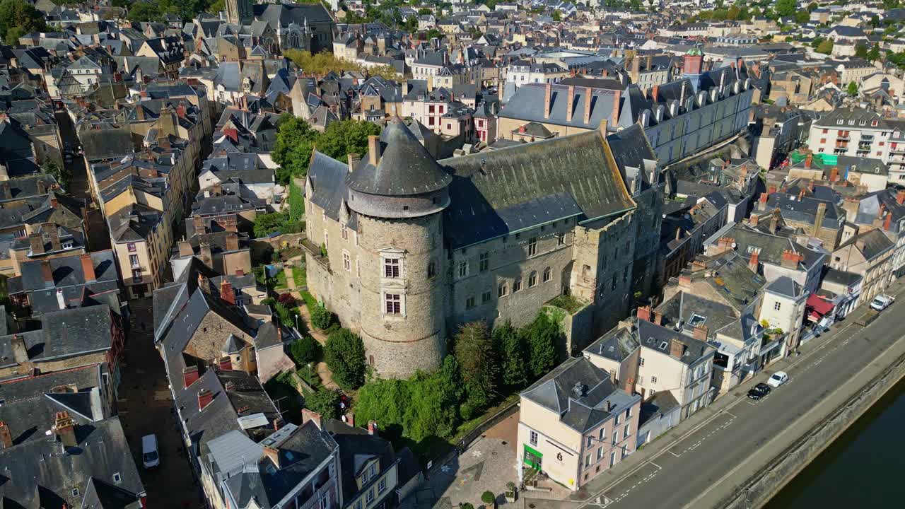 Aerial pullback from Chateau de Laval or Laval Castle highlighting old stonework and layout of structure