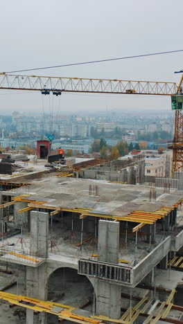 construction of a residential apartment complex. aerial view. vertical video