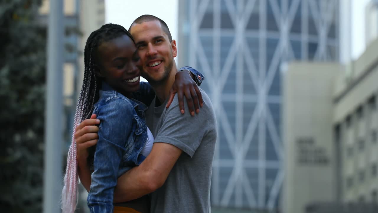 Couple embracing each other in the city 4k