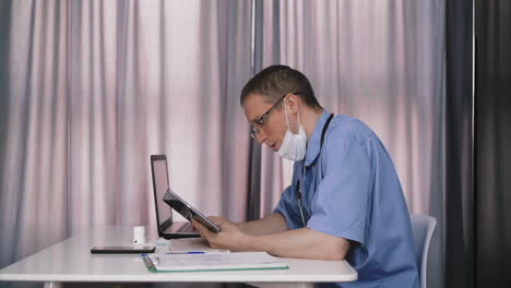 doctor-with-glasses-talking-online-with-colleague