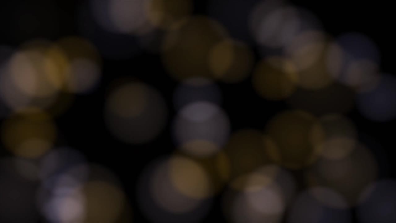 Luci bokeh astratte in movimento su sfondo nero