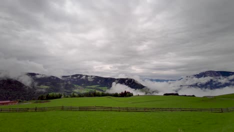 a field with a very cloudy sky