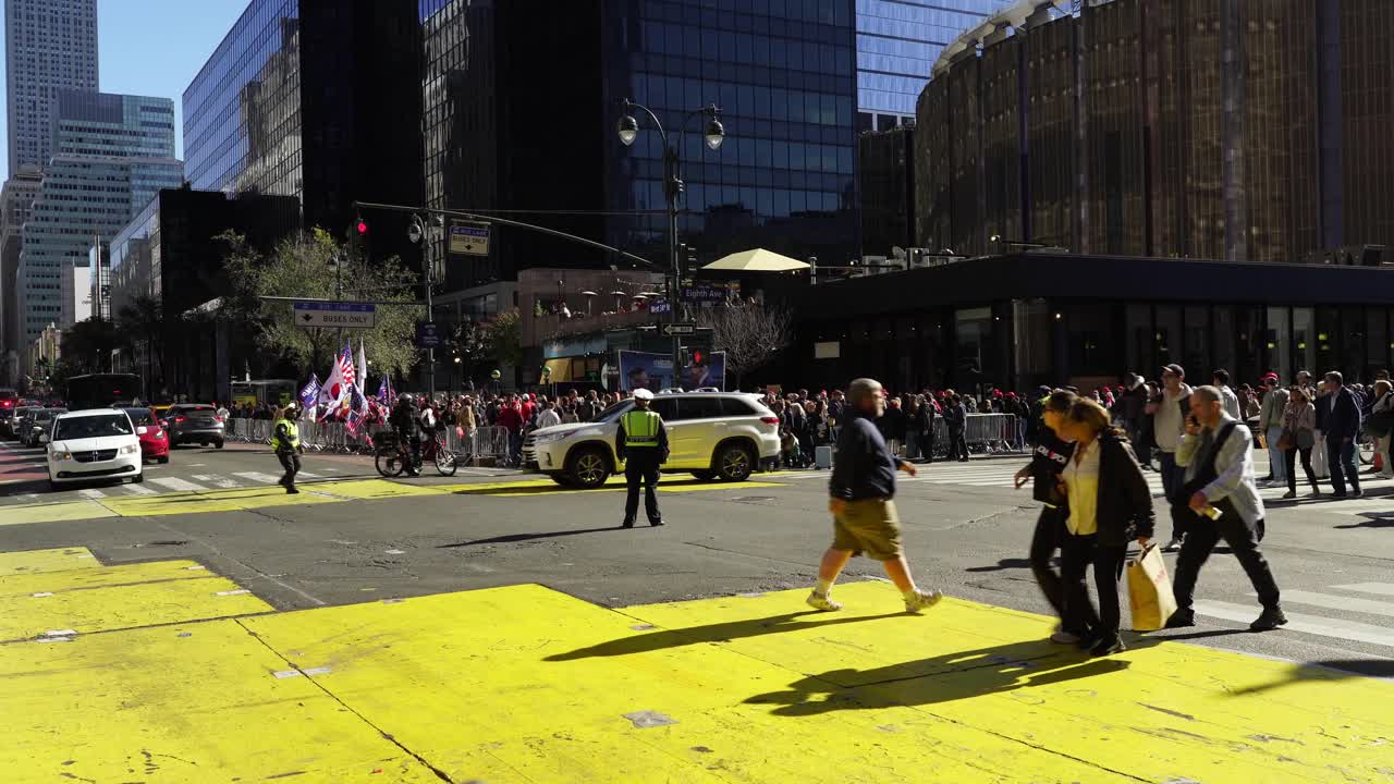 A sea of Trump’s supporters fills the streets around Madison Square Garden, their excitement shining brightly in the warm daylight