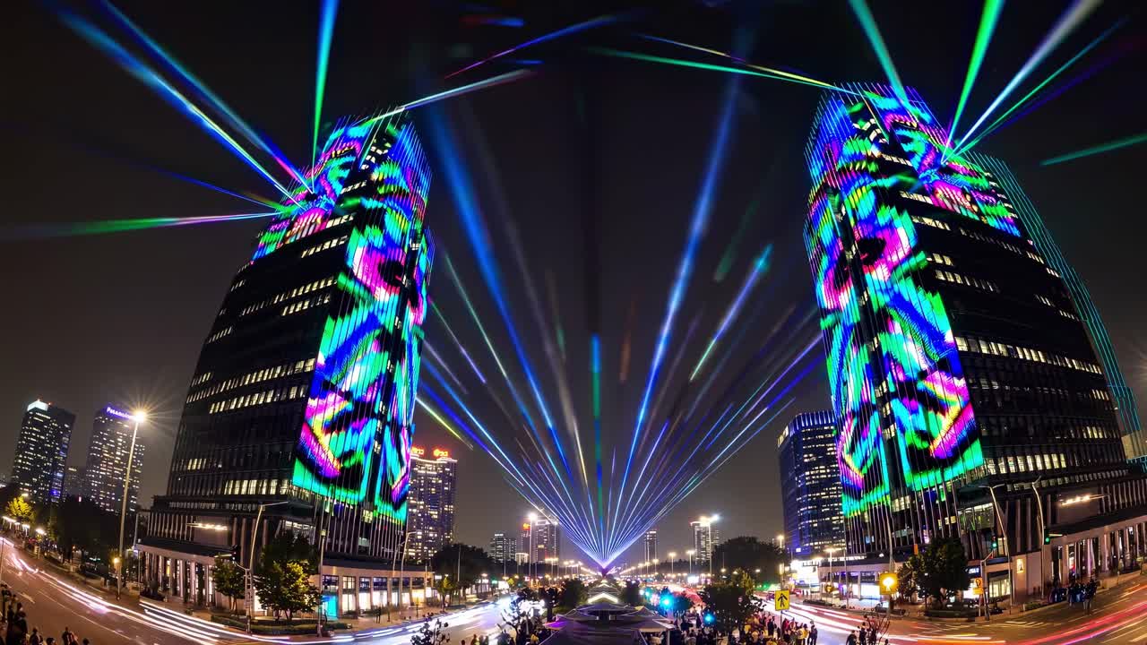 Colorful laser beams illuminating towering skyscrapers during a vibrant night light festival, creating a festive and energetic atmosphere throughout the bustling urban landscape