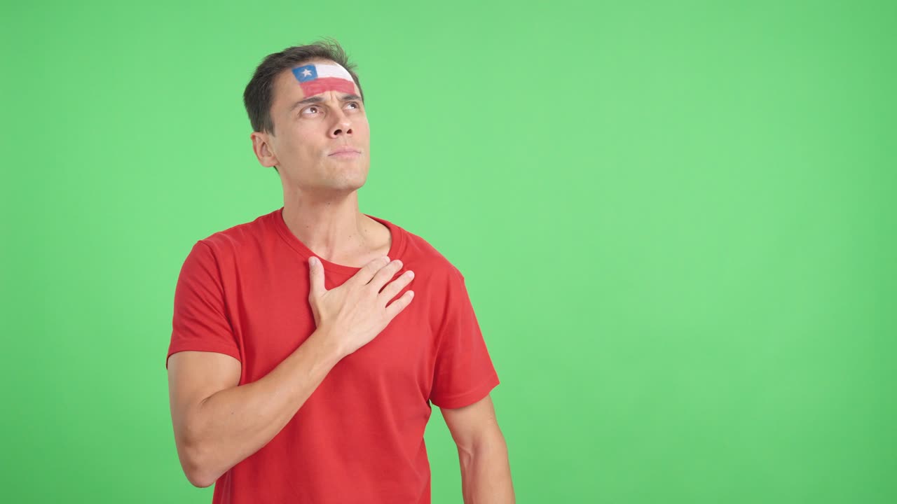 Man listening to the Chile national anthem with solemnity