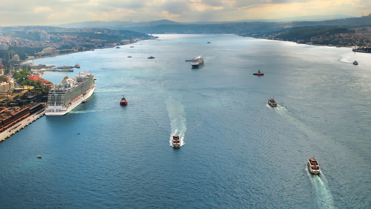 Aerial drone view of Istanbul, Turkey. Bosporus strait with multiple floating and moored ships, residential buildings, cityscape on the background