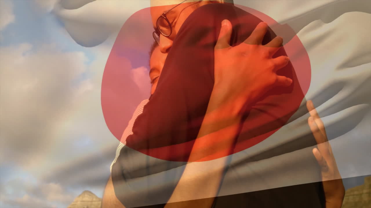 Embracing warmly, couple with animation of abstract red shape in background