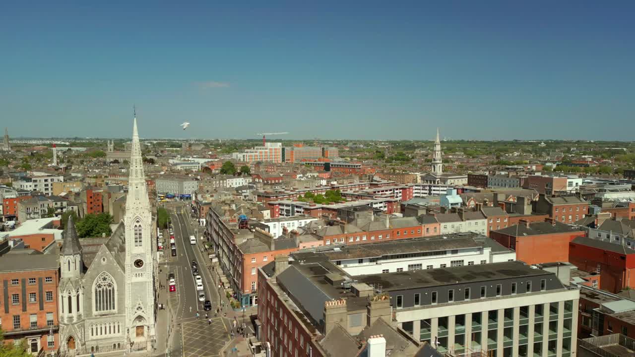 Wide reversing aerial video of Abbey Presbyterian Church and the surrounding area in Dublin City Centre, Ireland on a bright and sunny day. Filmed in 4K, 60FPS and with Rec709 color.