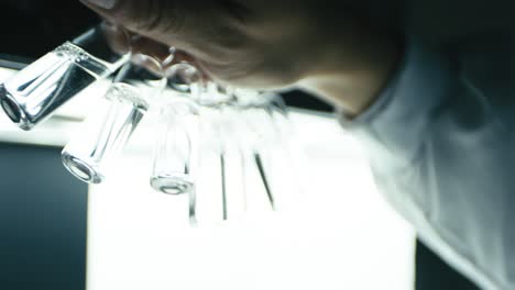 scientist shaking serum fluid in mini glass tube in research at drug modern laboratory