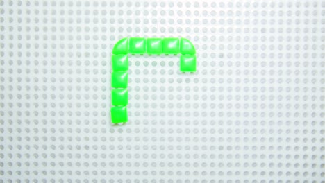 stop motion of the letter c creating one pixel at the time, made with children toys