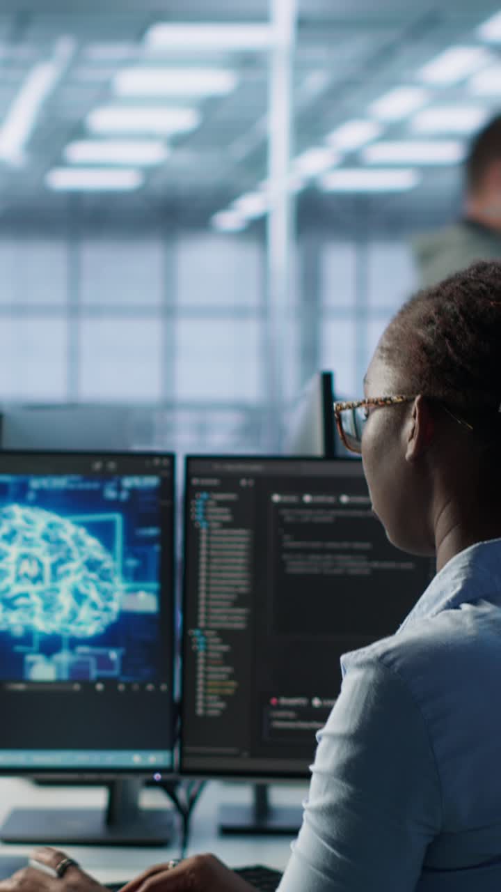 Woman Programmer Working on Computers with Brain Scan