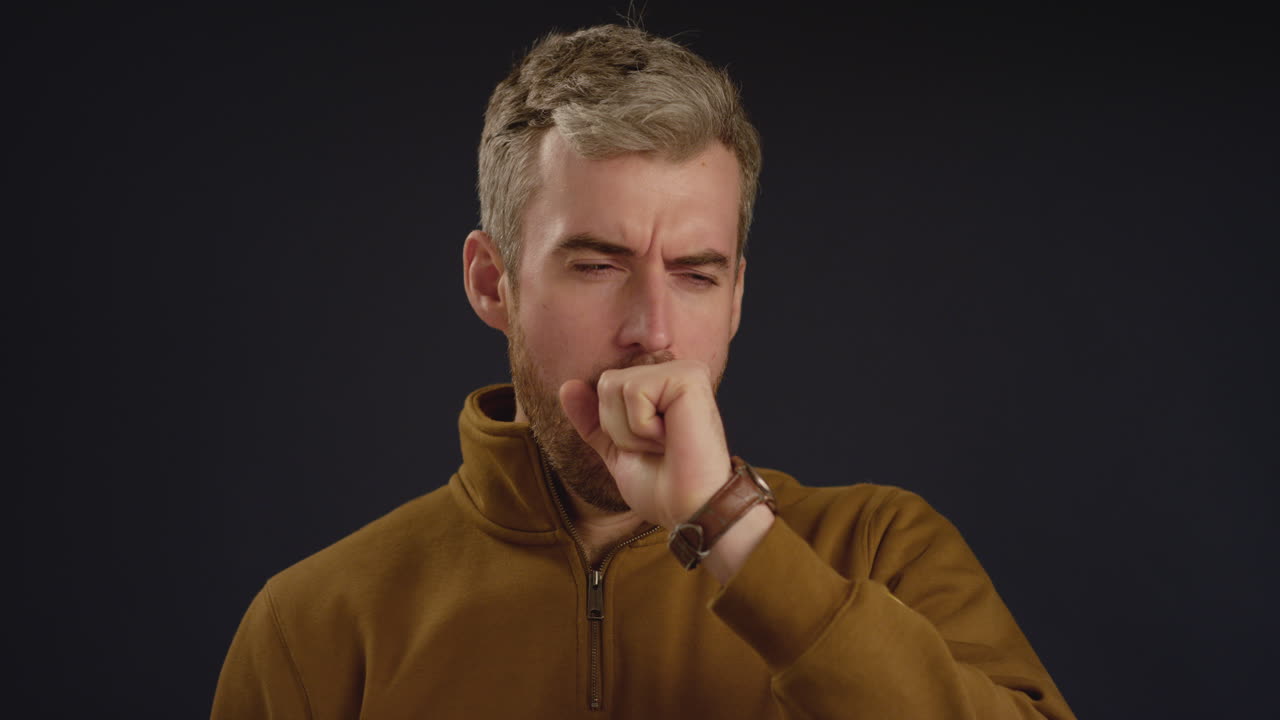 Tired Man Yawns Facing Camera