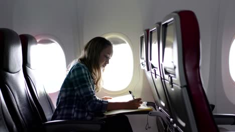 Girl-in-airplane-working