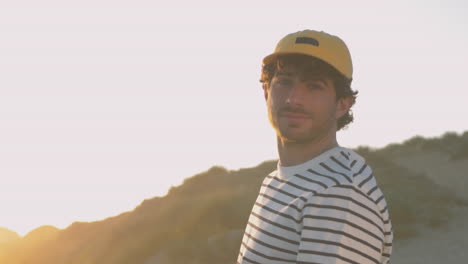 portrait of athlete man with cap smiling and looking at camera 1