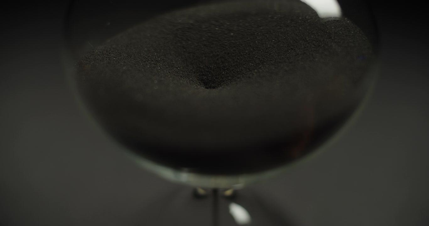 Macro shot of black sand moving