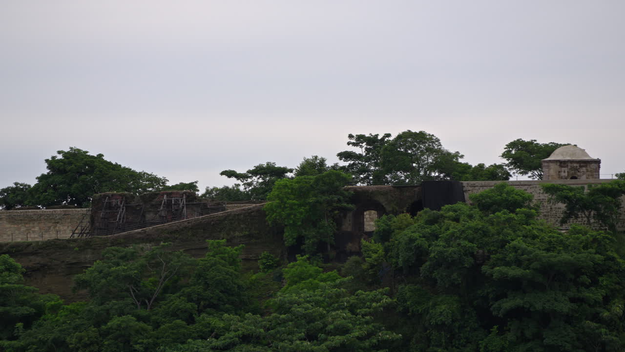 Close-up panning shot of the abandoned San Lorenzo Fort Ruins in Colon