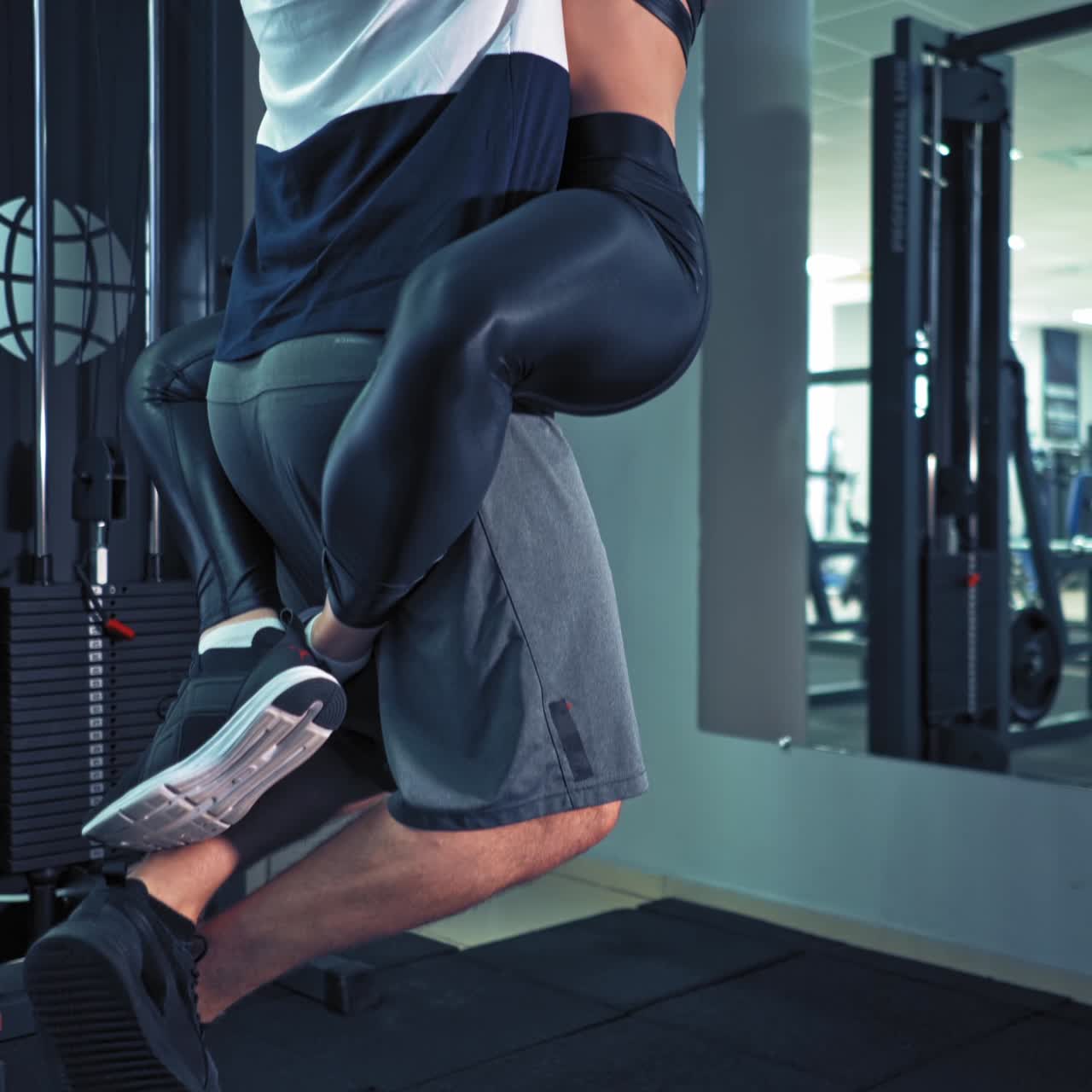 Couple exercising together at gym