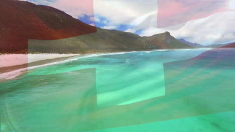 digital composition of waving switzerland flag against aerial view of the beach