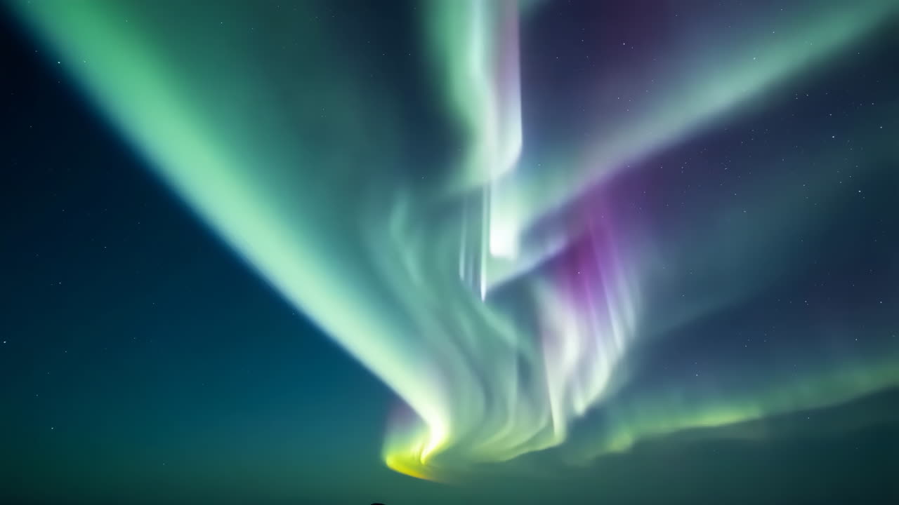 Vibrant Aurora Borealis dancing across a starry night sky