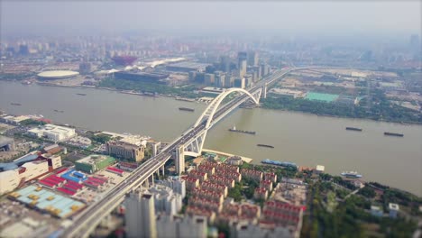 day time shanghai cityscape traffic lupu bridge riverside aerial panorama 4k tilt shift china