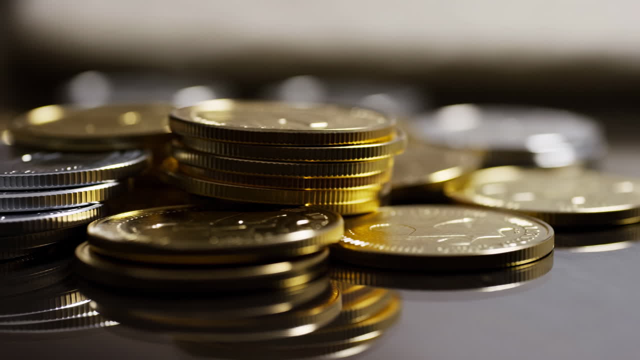 Gold Silver Coin Stacks Shimmering On Reflective Surface, Warm Lowkey Lighting And Shallow Depth Of Field