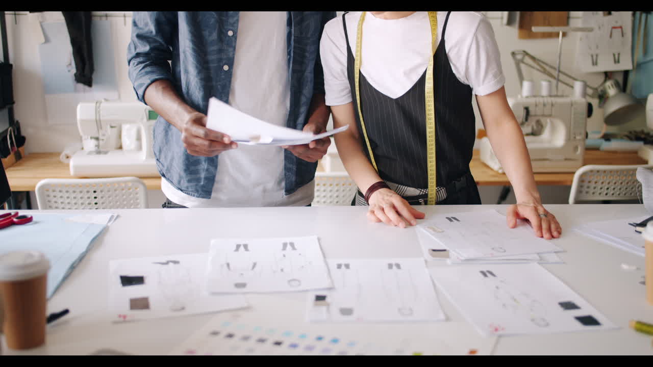 Fashion Designers Collaborating on Designs