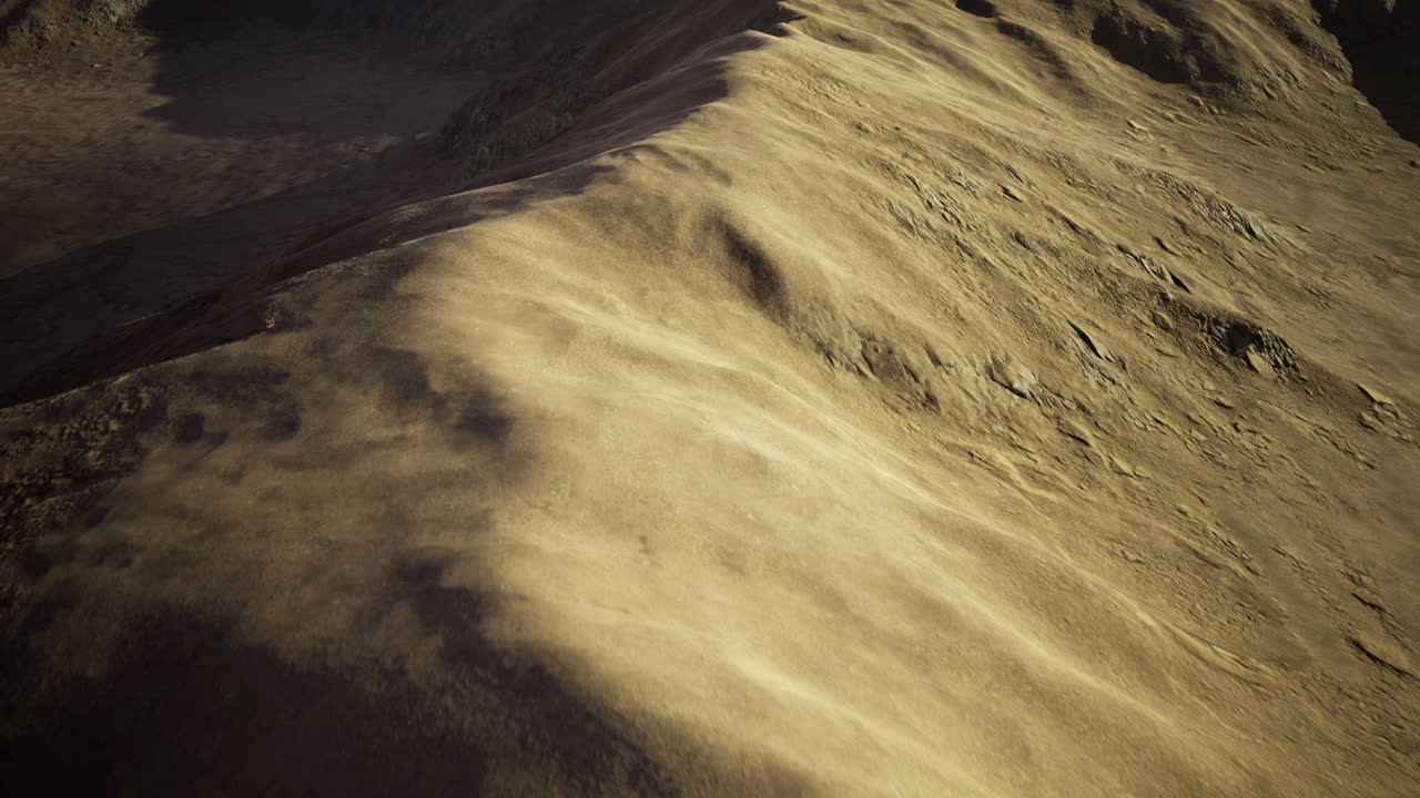 Sand dunes create picturesque landscape under sunlight in remote area