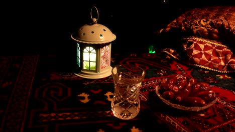 water and dates. iftar is the evening meal. slider view of decoration ramadan kareem holiday. festive greeting card, invitation for muslim holy month ramadan kareem. dark background. selective focus