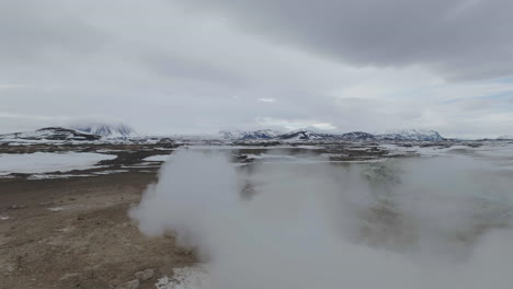 aerial view of geyser geothermal area in landscape of iceland, drone shot