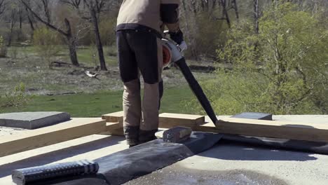 roofing construction with leaf blower